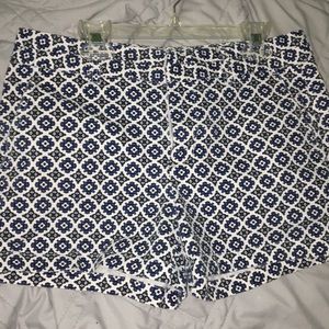 white, black, & blue design shorts.